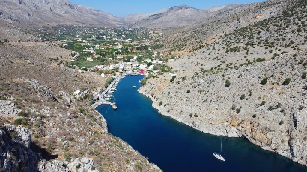 Tucked away on the eastern side of the island is the lush, green valley of Vathy, completely contrasting the island's mostly rocky landscape. As you travel through the valley filled with citrus and tangerine groves, the road eventually ends at the enchanting port of Rina.